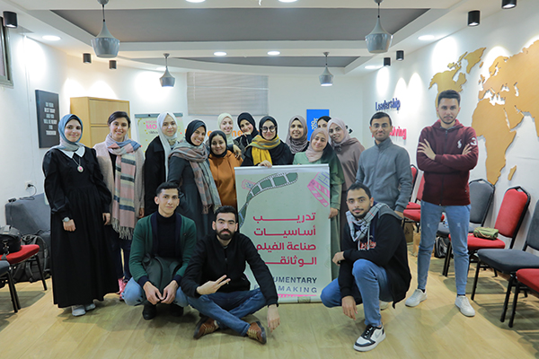 Image shows a group of young filmmaking students led by Aya Matrabie, a ConnectHER Fellow recipient.